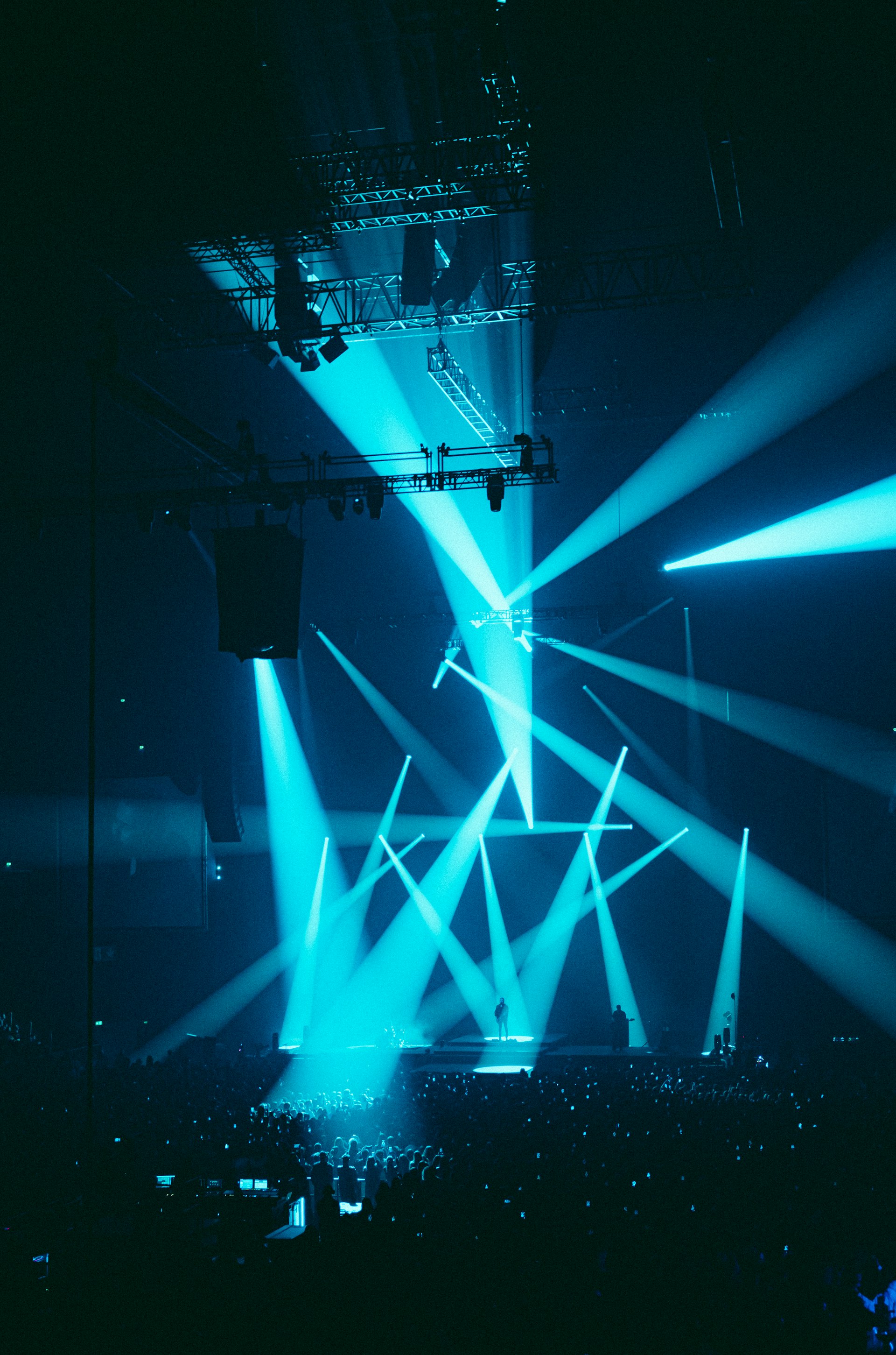 Concert stage with blue and green lighting beams